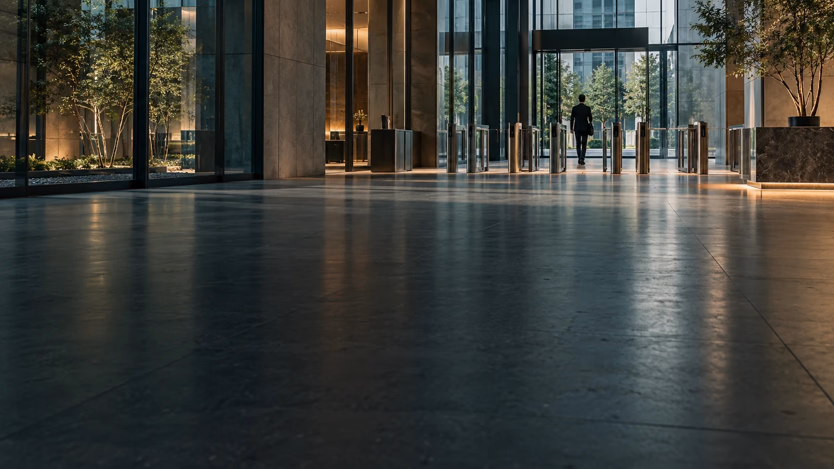 Glass and steel enterprise entrance with a controlled access threshold.