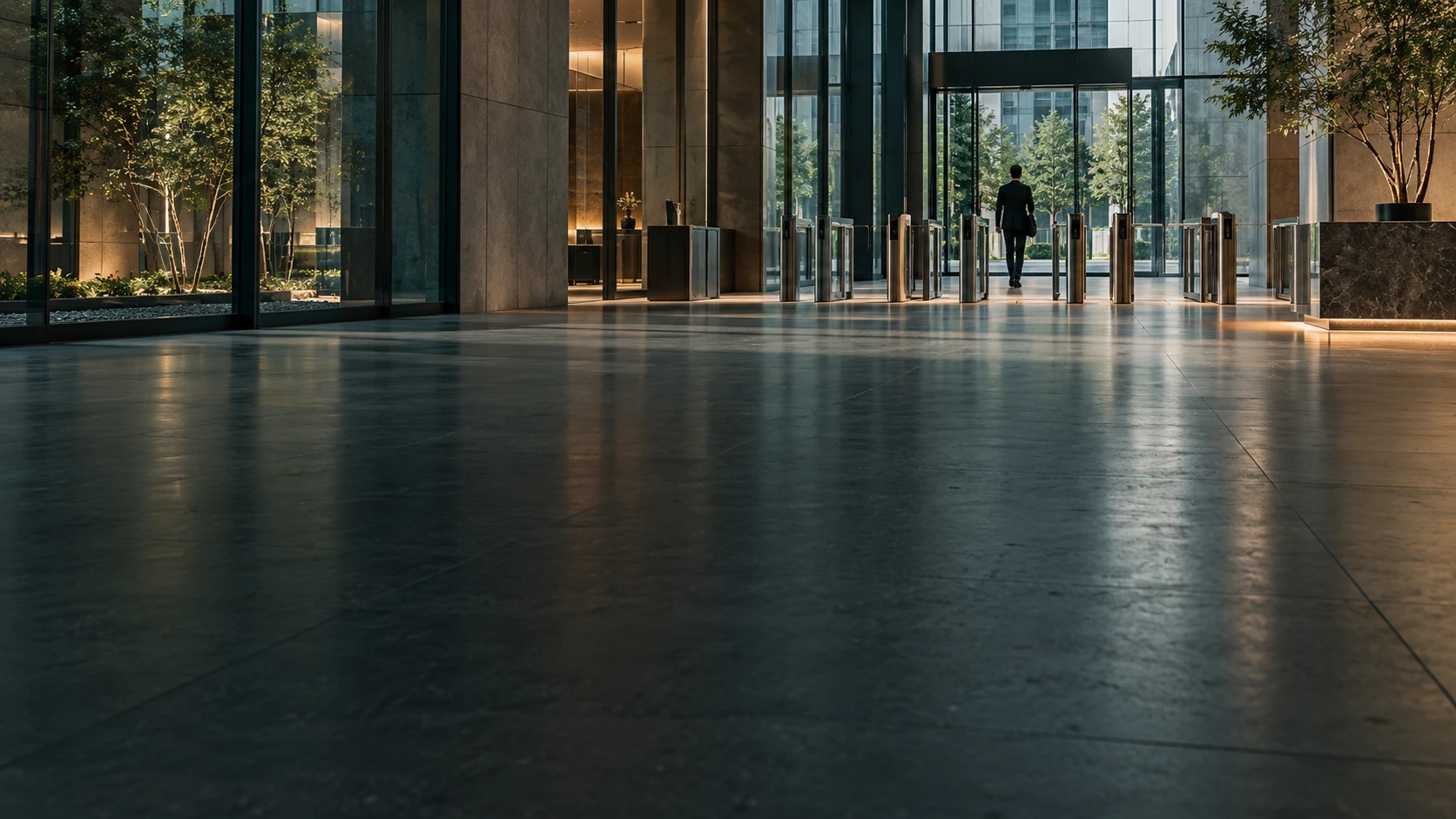 Glass and steel enterprise entrance with a controlled access threshold.
